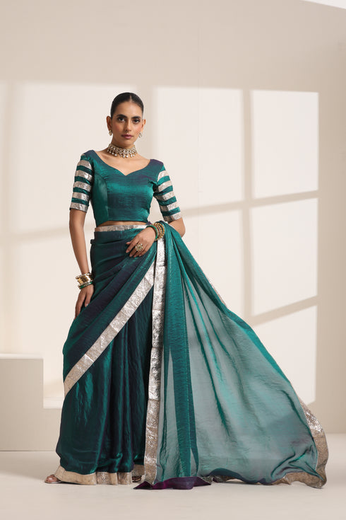 Teal Blue Silk Organza Saree with Silver Lampi Lace Border