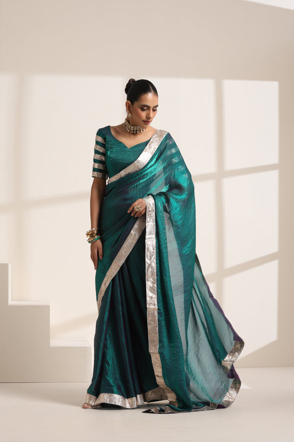 Teal Blue Silk Organza Saree with Silver Lampi Lace Border