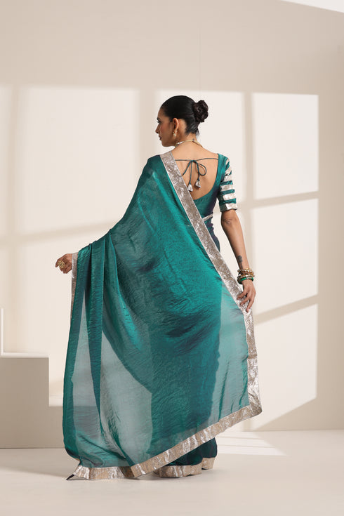 Teal Blue Silk Organza Saree with Silver Lampi Lace Border